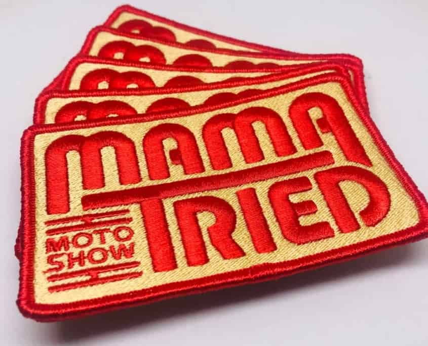 2.35 inches tall propotional width bright red MAMA TRIED moto show iron on back support patches over white studio background